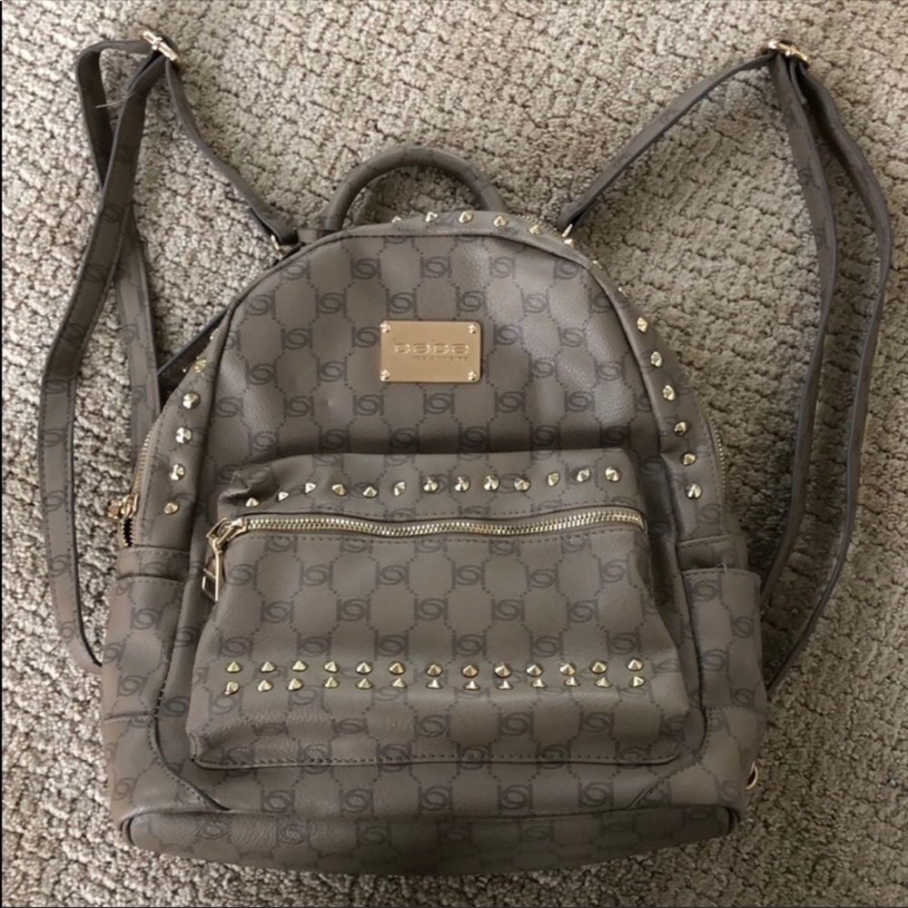 Bebe Gold stud embellished backpack purse
